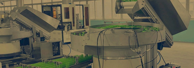 Component feeding equipment moving parts through an automated production process